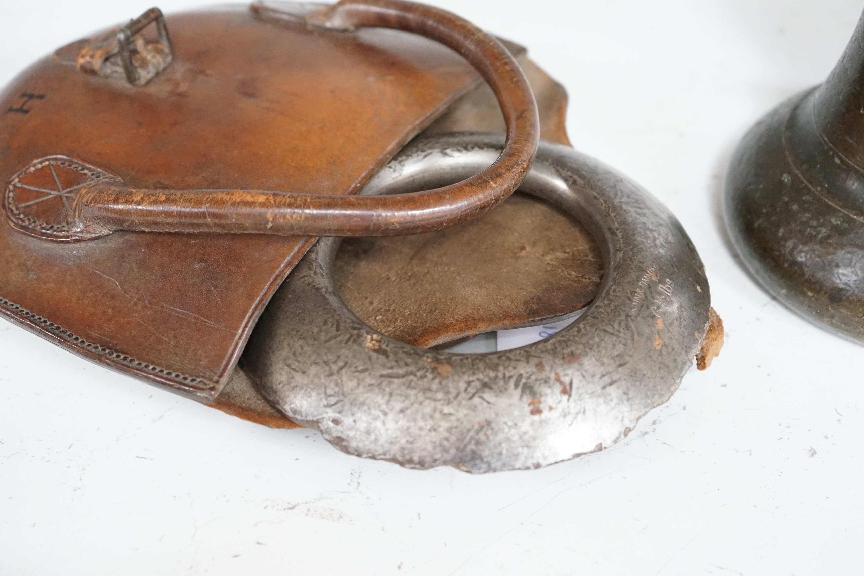 A single Victorian inscribed weight, together with quoits in brown leather case initialled G.H.